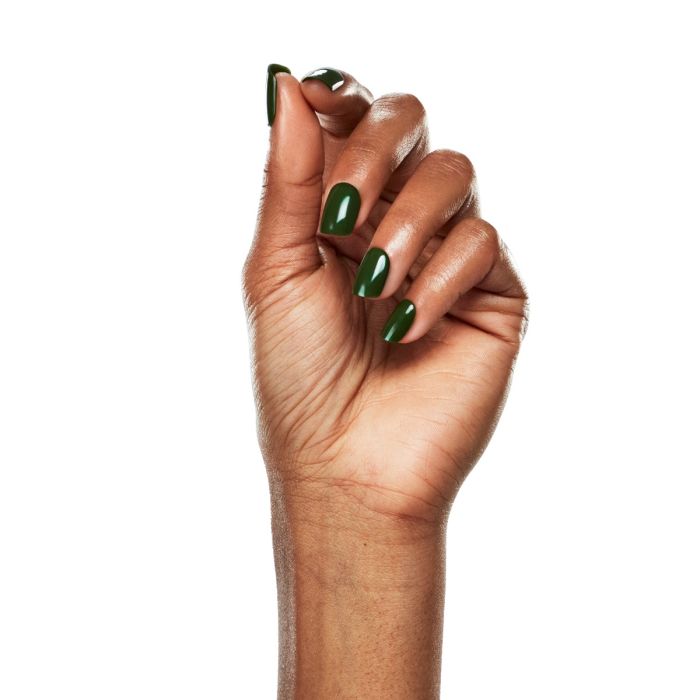 Close-up of hand wearing Ardell Tenderness, highlighting the shine and depth of its olive green gel finish.