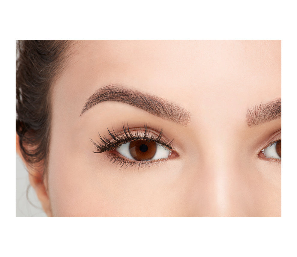 Close-up of a model's open right eye wearing an Ardell Faux Mink 810 false lash