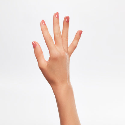 A lady's hand with beautiful nail color.
