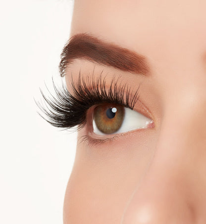 Side view close-up of a model's open right eye wearing Ardell Mega Volume 261 faux eye lashes