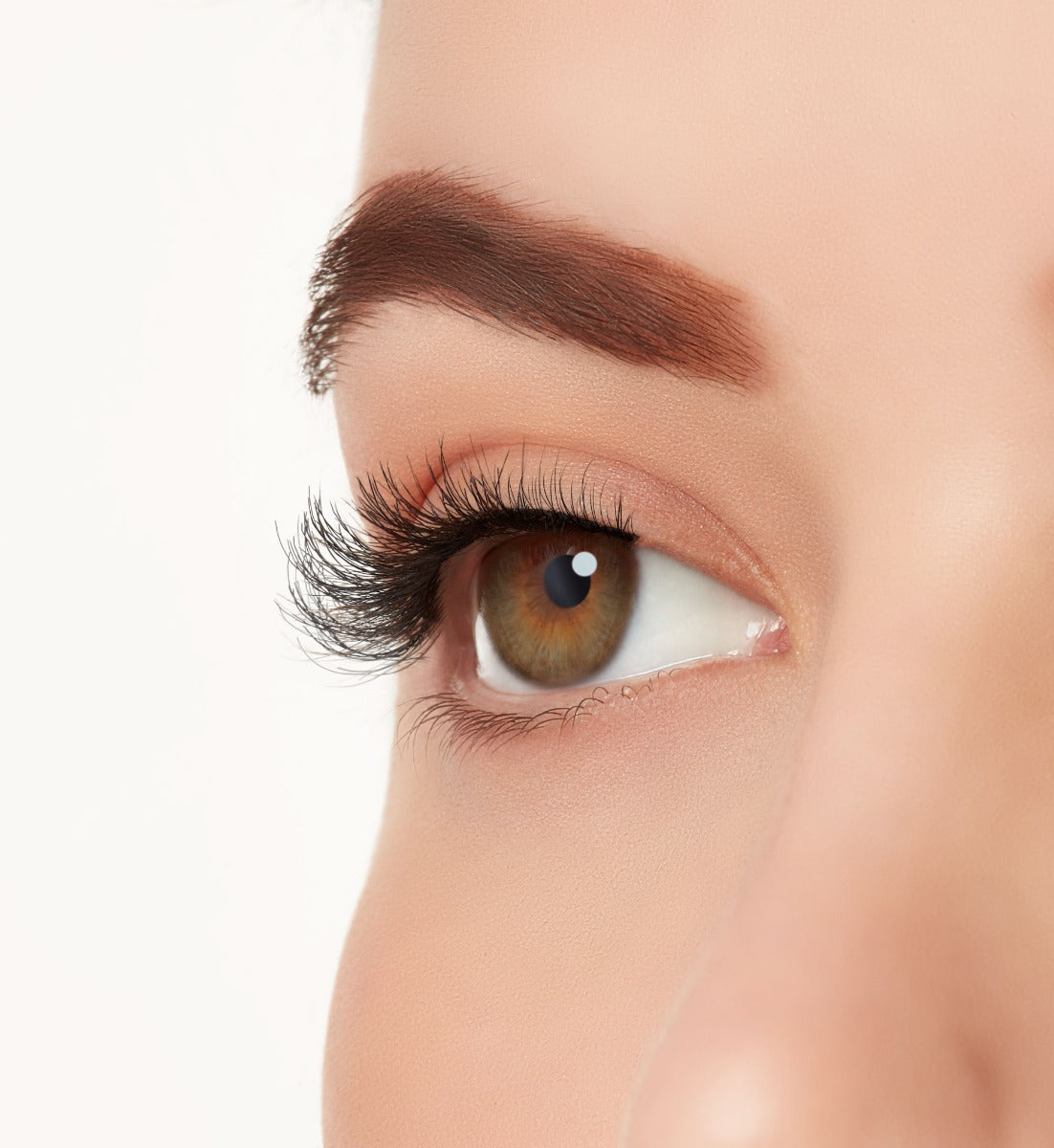 A side close-up picture of Ardell's Ecolashes 454 on a models eye giving natural, round flared eye makeup look
