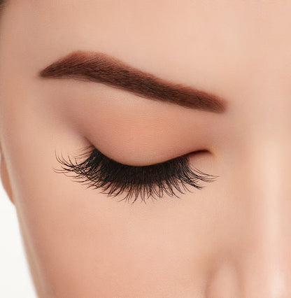 A woman with close eye wearing Ardell Active Lash Chin Up lashes