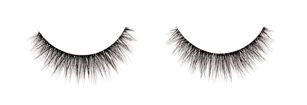 A single pair of Ardell Faux Mink 815 featuring its short length and round shaping