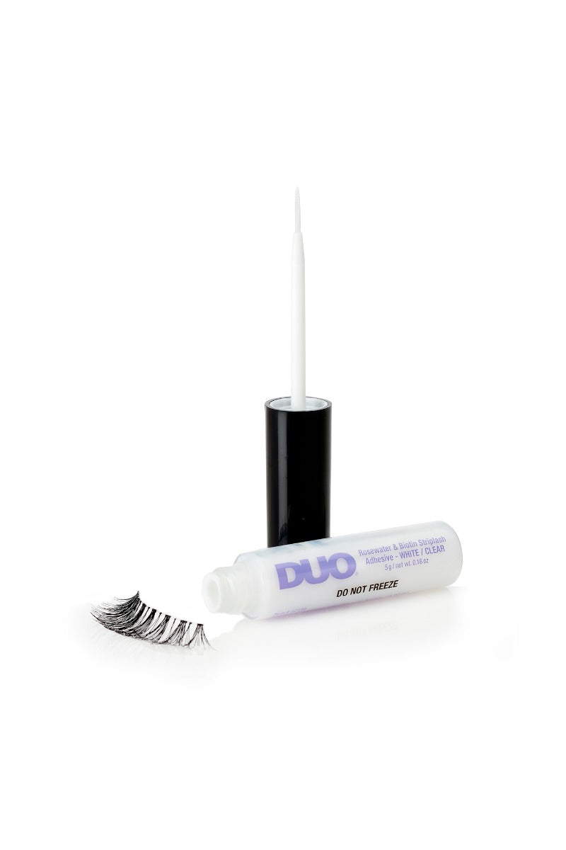 DUO Rosewater & Biotin StripLash Adhesive white/clear with precision brush, shown with a false lash for easy application.