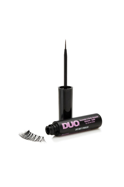 Open DUO Rosewater & Biotin Striplash Adhesive bottle with fine brush tip applicator, ideal for precise lash application.