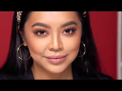 Model Wearing Ardell Lashes & Brows – Woman with voluminous false lashes and defined brows using Ardell products.